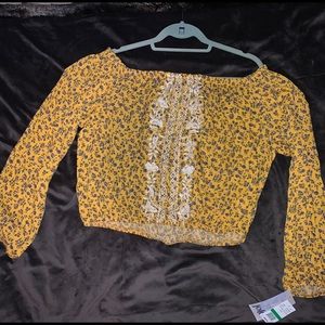 Jolt. Off shoulder. Long sleeved crop.